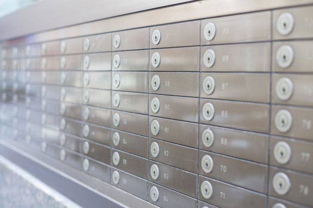 a bunch of buttons on a metal wall.