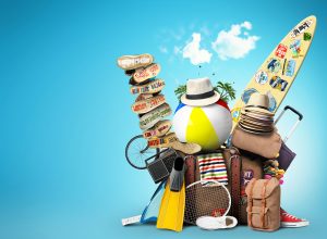 a pile of luggage sitting on top of a blue background.